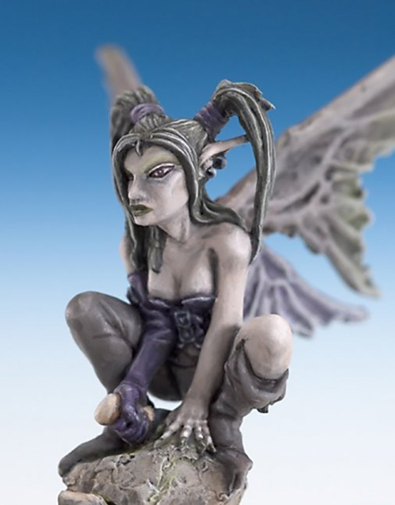 Crouching dark fey miniature with large gray wings, gray skin, and purple gloves, perched on a rock base