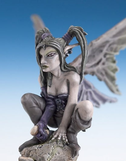 Crouching dark fey miniature with large gray wings, gray skin, and purple gloves, perched on a rock base