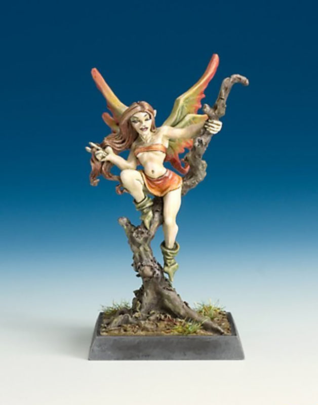 Painted fantasy miniature of a female fairy figure with orange wings and skirt climbing a dark tree stump