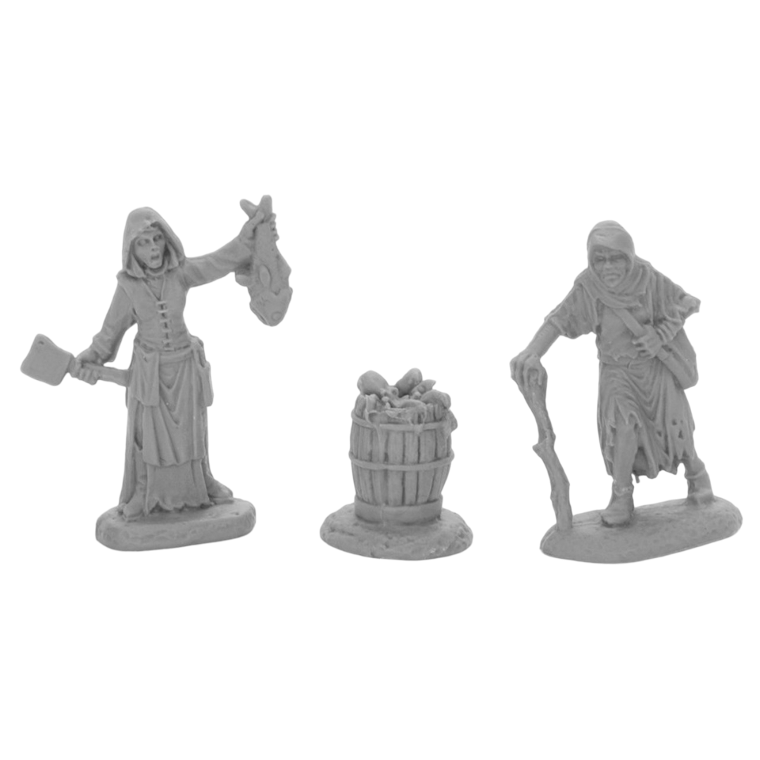 Two gray miniature figures, a fishwife with a cleaver and fish, and a cloaked crone with a staff, stand next to a barrel of goods
