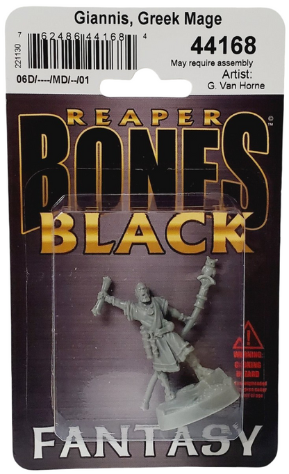 A gray plastic miniature of Giannis, Greek Mage, holding a scroll and an owl-topped staff, packaged in clear plastic on a dark card