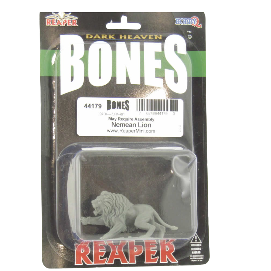 A gray Nemean Lion Bones miniature in a clear blister pack