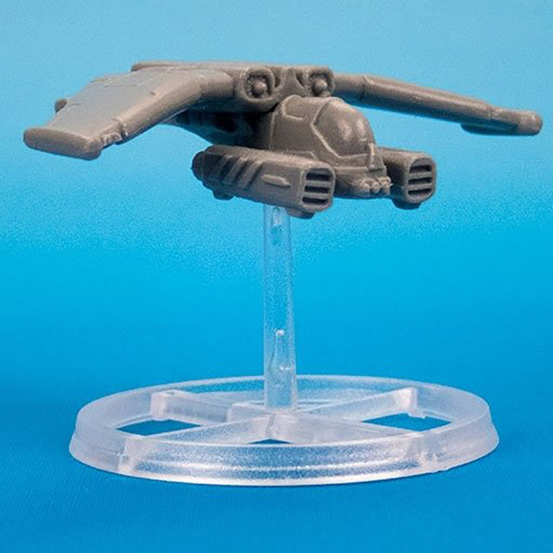 Unpainted plastic starfighter miniature model on clear flight stand against blue background