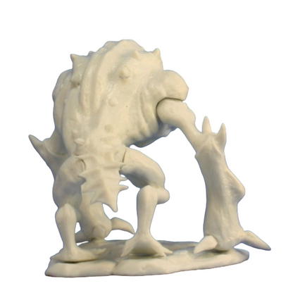 A cream-colored Reaper Bones Toad Demon miniature with a bumpy back, short legs, and one long, club-like arm on a round base