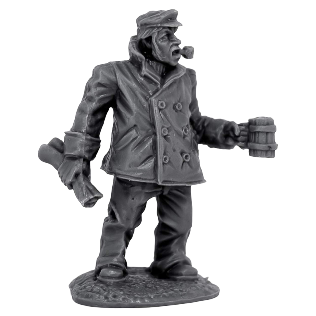 A gray miniature of a Reaper Chronoscope Bones Ship Captain in a coat and cap, holding a pipe in his open mouth, a mug, and a scroll