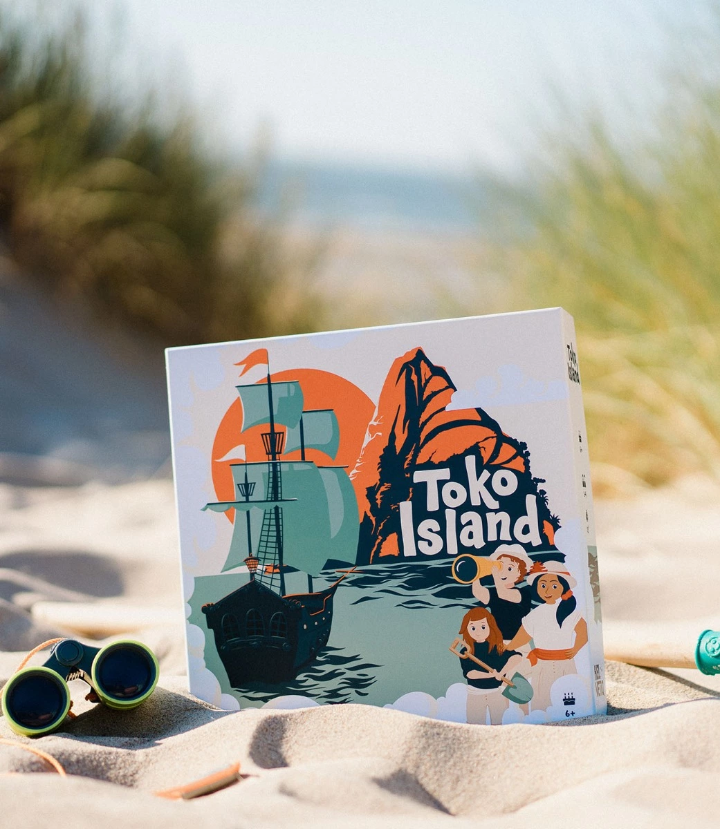Toko Island game box displayed on sand beach view