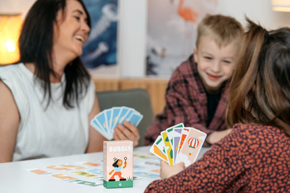 Close-up of players enjoying a session of Bubbly card game