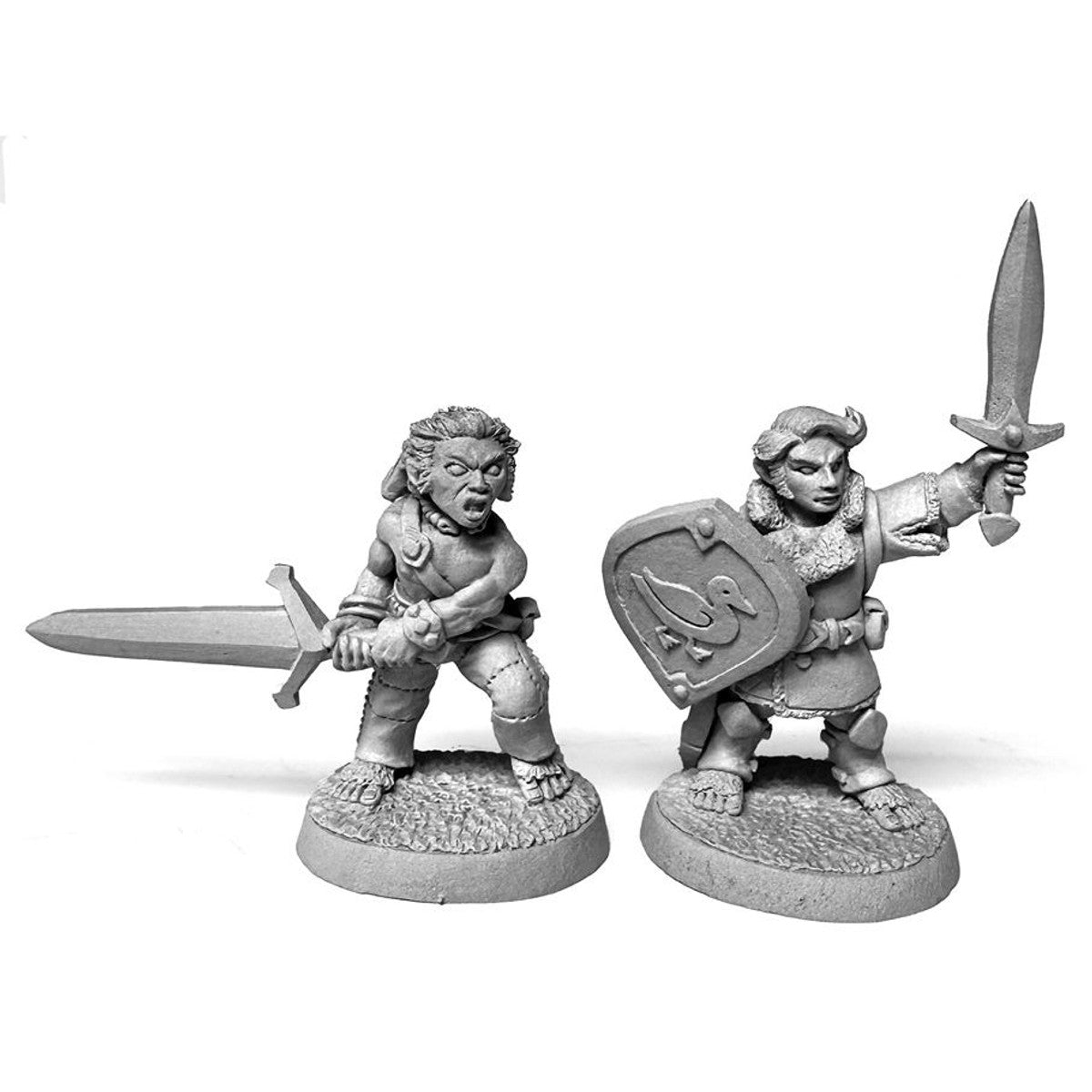 Two unpainted metal halfling fantasy miniatures wielding swords; one holds a shield with a duck emblem