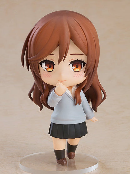 Chibi anime figure of a brown-haired girl with a gray school sweater over a white shirt and black pleated skirt
