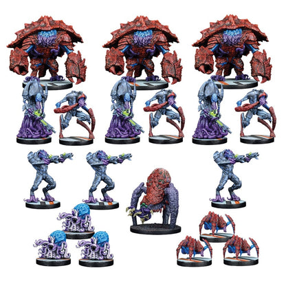 Assorted painted tabletop miniatures: three large red crab-monsters, grey alien warriors, and various small creatures