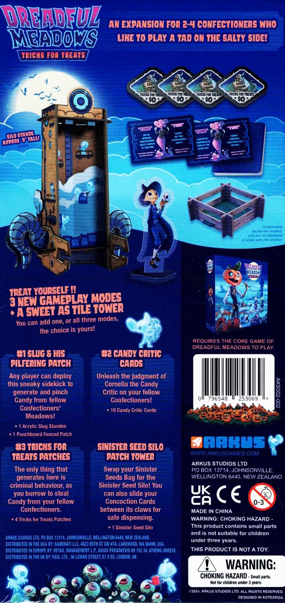 Dreadful Meadows Tricks For Treats Expansion shows its game box, a tall silo, character standees, cards, and other game pieces on a blue background