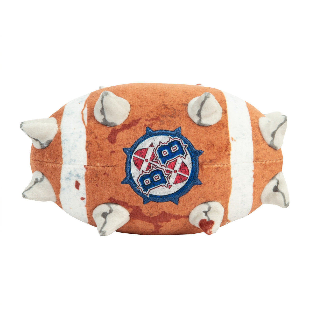 An oblong Warhammer Blood Bowl plush toy is colored distressed orange and white, covered in soft spikes, and features an embroidered logo