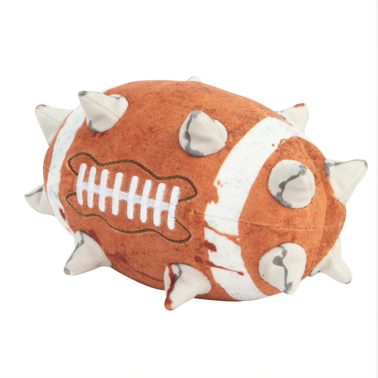A fuzzy, orange and white Warhammer Blood Bowl plush ball, featuring stitched laces and multiple soft, blood-stained spikes protruding from the surface