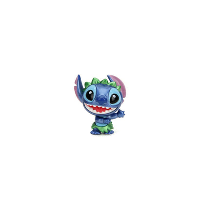 Blue Stitch vinyl figure in a green hula outfit (grass skirt and leafy crown) with a wide, toothy grin