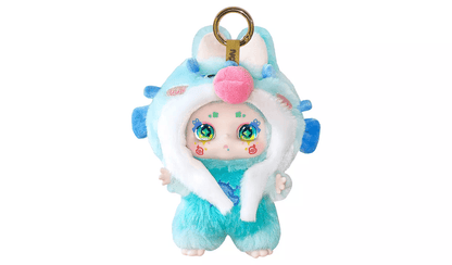 Fluffy blue fantasy plush toy keychain with large green eyes, pink nose, and a white-trimmed creature hood