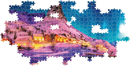 Clementoni Panorama 1000-piece puzzle of Lofoten Island Norway at night featuring snow-covered houses glowing warmly amidst a purple and blue winter landscape