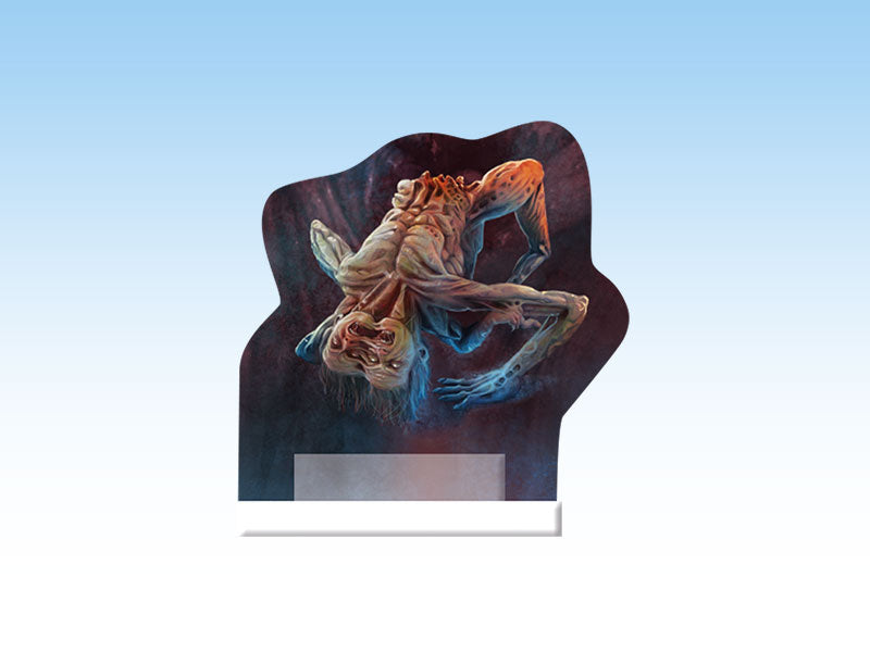 Emaciated, pale monster with glowing eyes and twisted limbs, hanging upside down on a dark standee