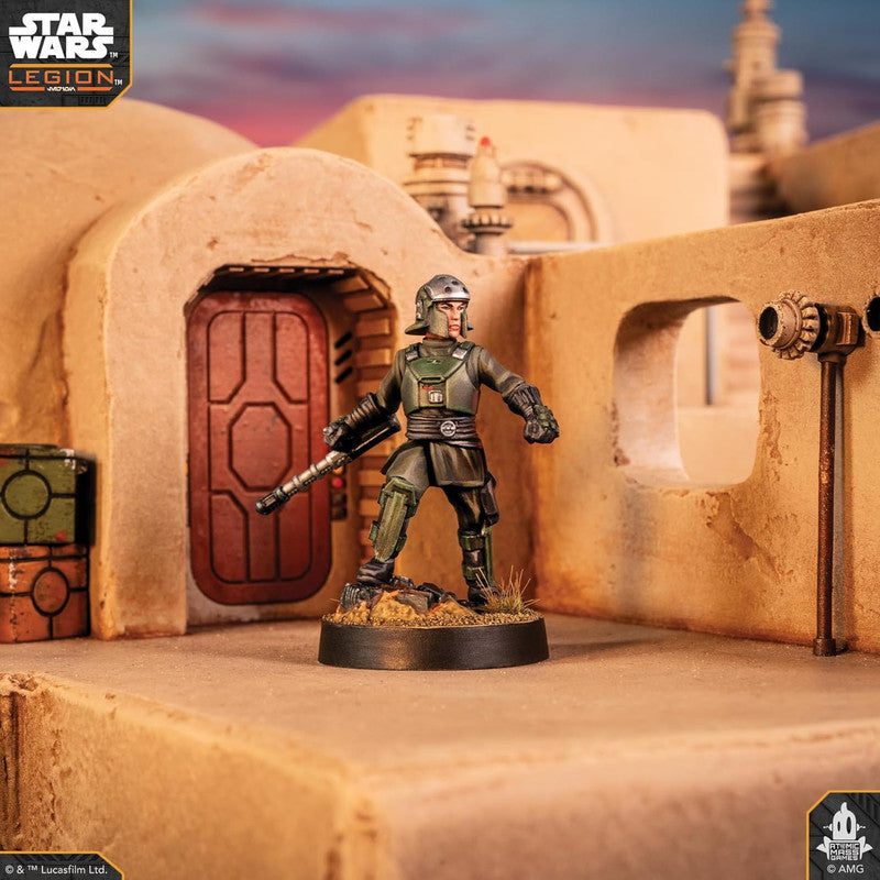 Star Wars Legion miniature of a soldier in green armor holding a rifle on a desert diorama base