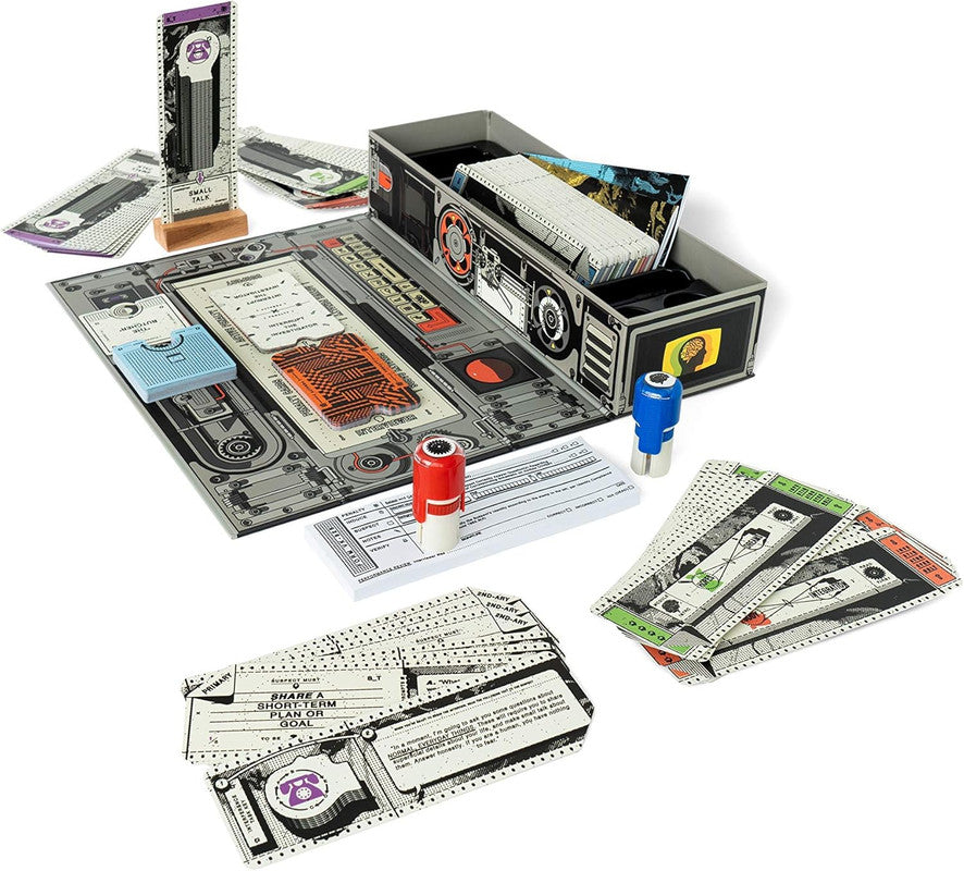 A retro-tech Inhuman Conditions board game setup: a grey machine-themed board, stacks of cards, red &amp; blue game pieces, and a &#39;Small Talk&#39; standee