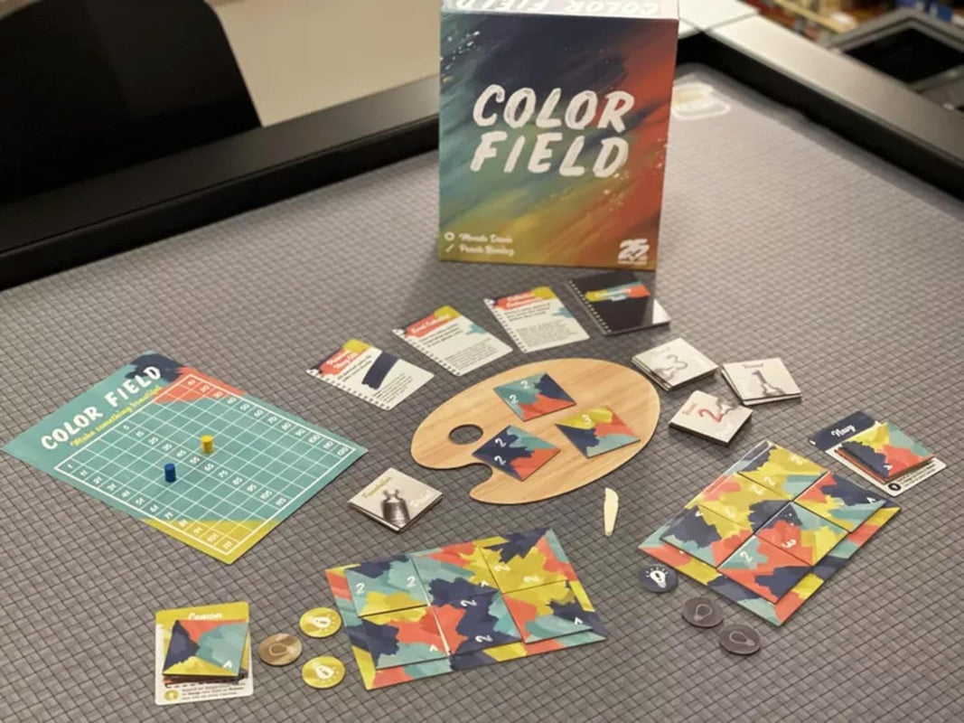 Color Field board game box and components spread across a grey surface