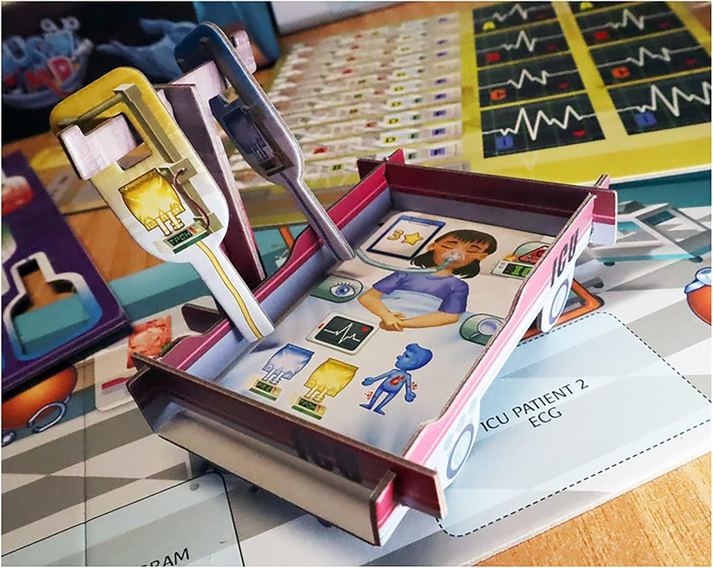 A pop-up cardboard board game piece: an ICU bed with a cartoon girl patient, medical tools, and ECG chart background