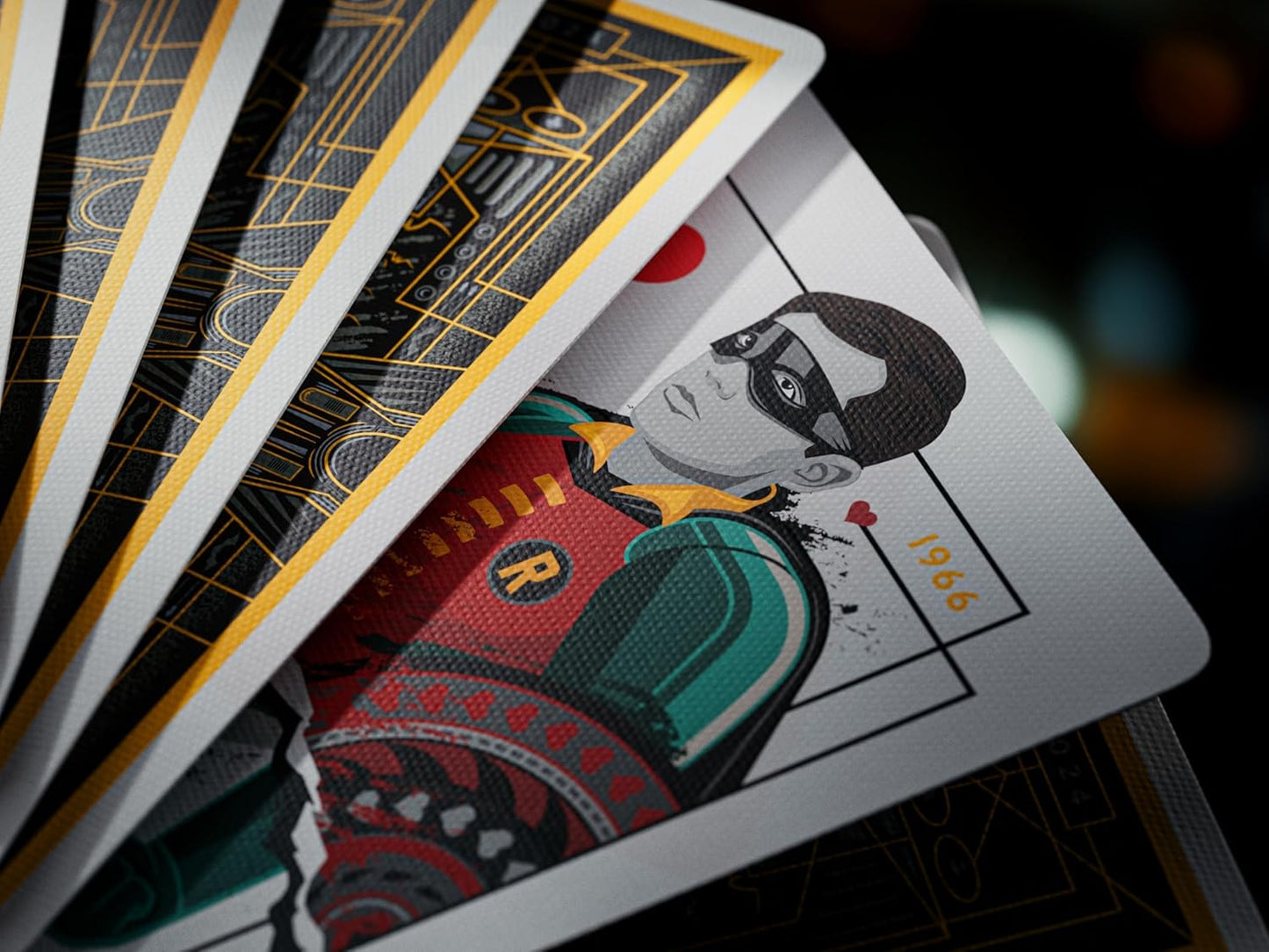 Fanned playing cards revealing a custom court card illustration of Robin the superhero, with black and gold backs