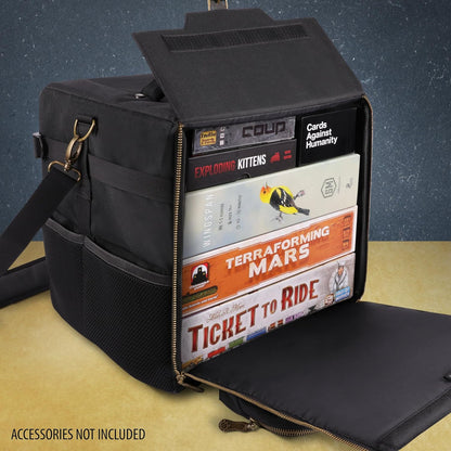 Open black board game organizer bag, packed with games including Wingspan and Ticket to Ride, on a table.