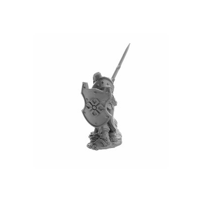 Unpainted plastic fantasy miniature knight, holding a large patterned shield and raised sword