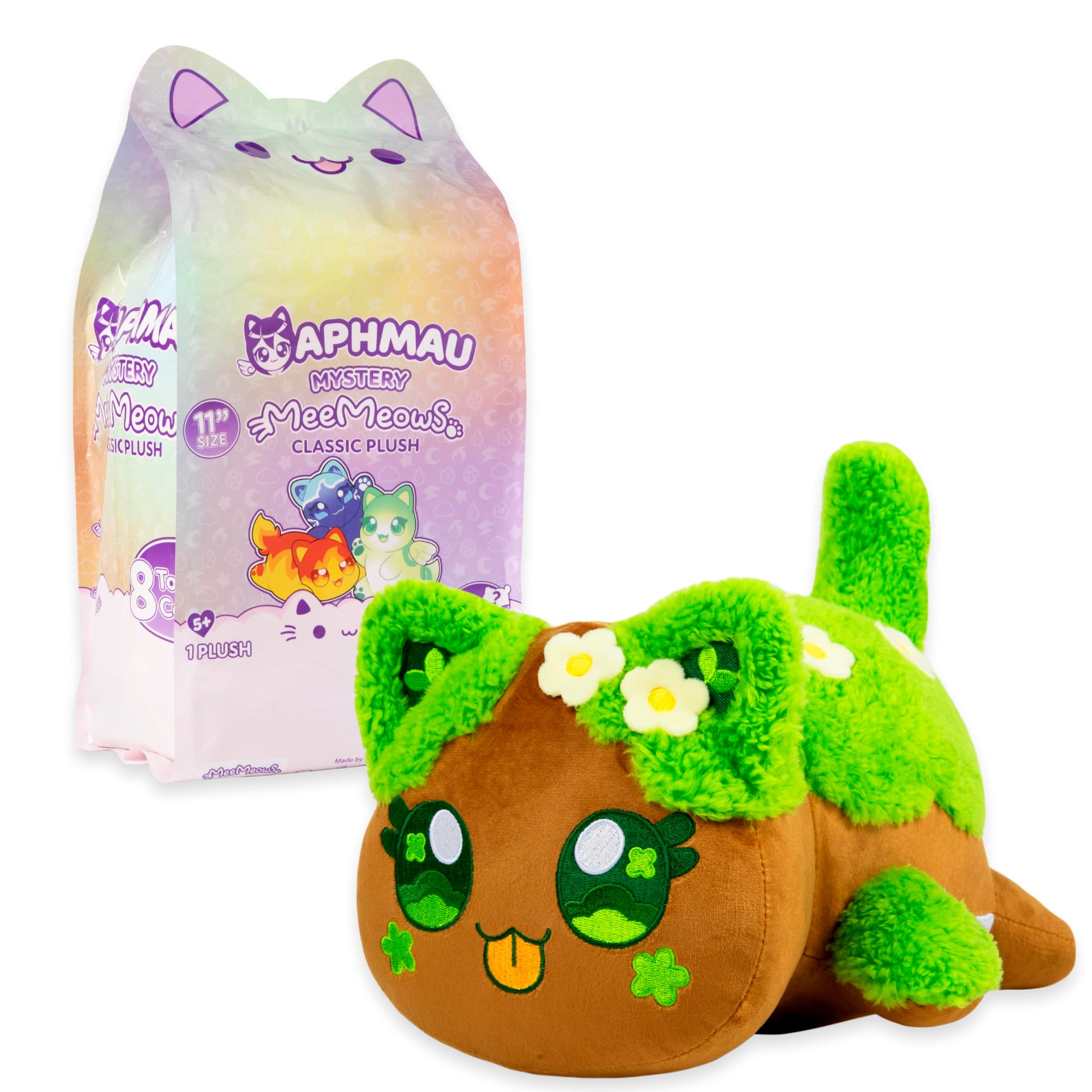 The brown and green Tree Elemental 11-inch Aphmau MeeMeow Classic Plush sits next to its colorful iridescent mystery bag packaging