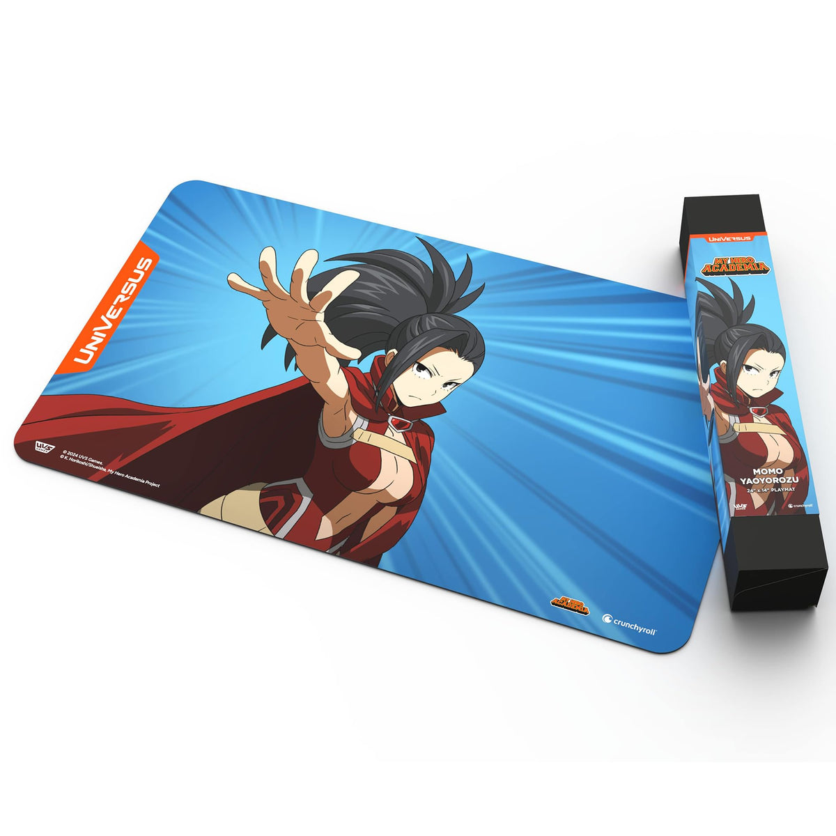 A UniVersus My Hero Academia Momo Yaoyorozu Playmat featuring the character in a red costume and cape, reaching out, displayed next to its roll packaging