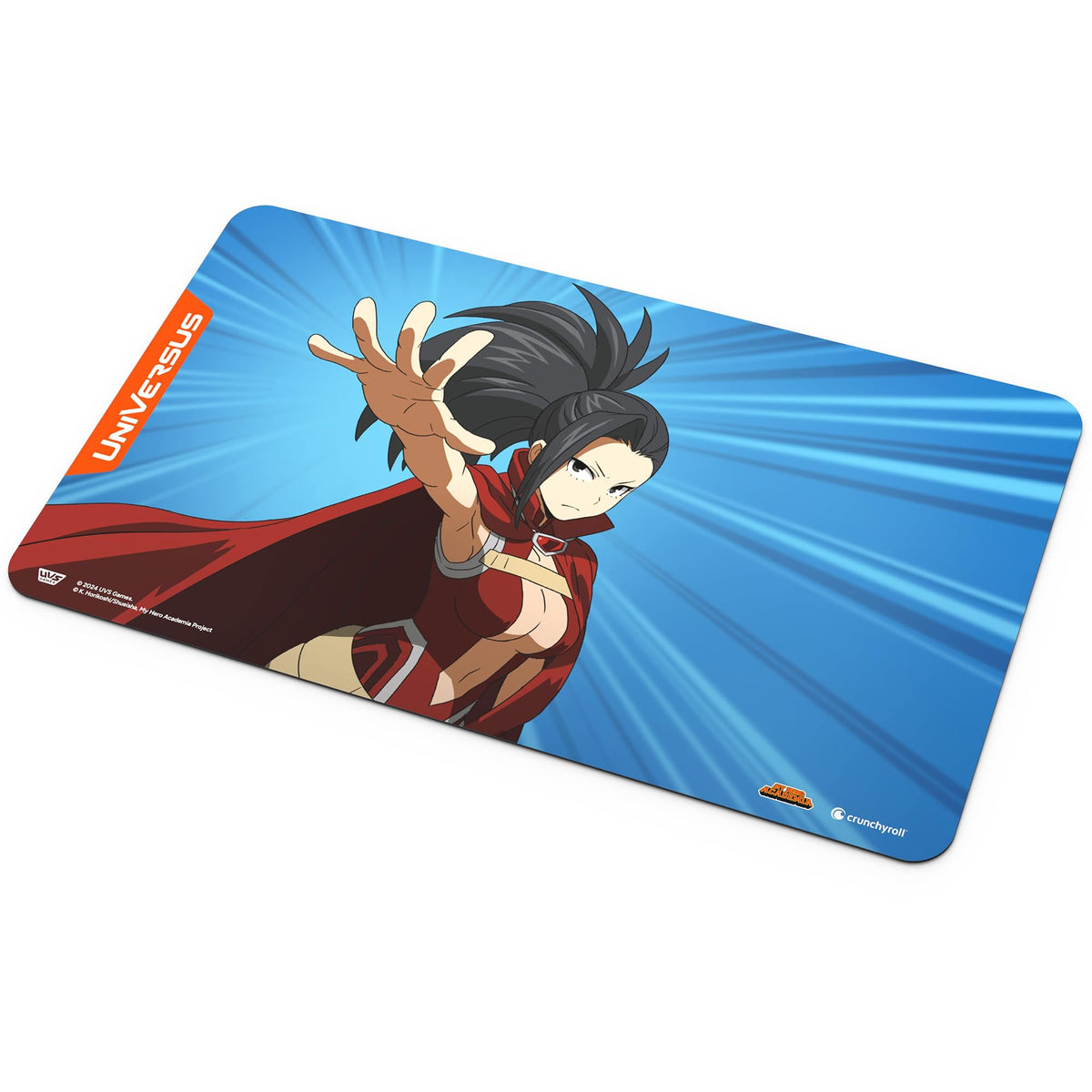 A rectangular playmat features a dark-haired anime character in a red costume and cape, reaching out against a blue background with light rays