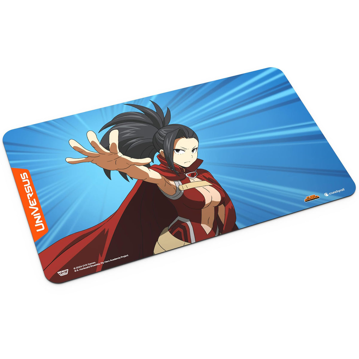 A UniVersus playmat shows an anime girl with dark hair and a red cape reaching out on a blue background with radiating lines