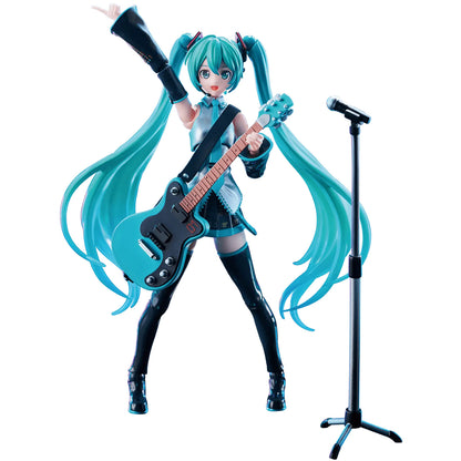 Dynamic Blokees Hatsune Miku figure in her signature outfit holds a blue guitar and points upward next to a separate microphone stand