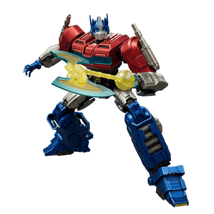 An action figure of Optimus Prime featuring detailed red and blue armor holding a bright translucent yellow battle axe