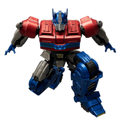 The detailed Optimus Prime figure is shown mid-crouch with spread arms, rendered in bright red, blue, and silver armor plating