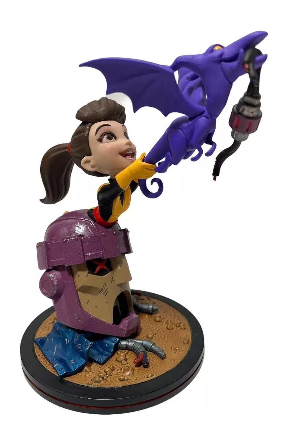 Purple Sentinel and Lilac Toy figurine featuring a small girl in yellow and black outfit reaching for a purple dragon holding a cable all mounted on a brown circular base