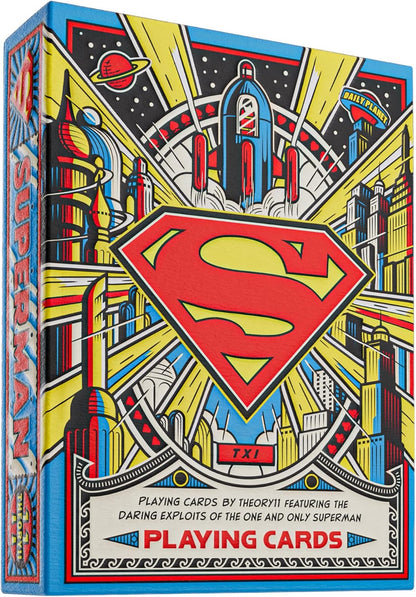 Colorful Superman playing card tuck box featuring the iconic red S-shield logo centered over a stylized city and rocket