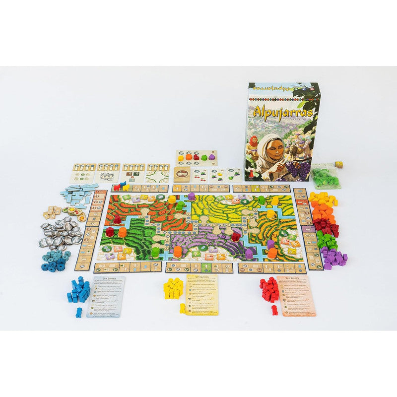 Alpujarras board game set up: colourful terraced map, meeples, tokens, cards, and game box with a woman harvesting grapes