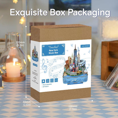 Brown box packaging showing the New York City 3D music box puzzle design and product dimensions