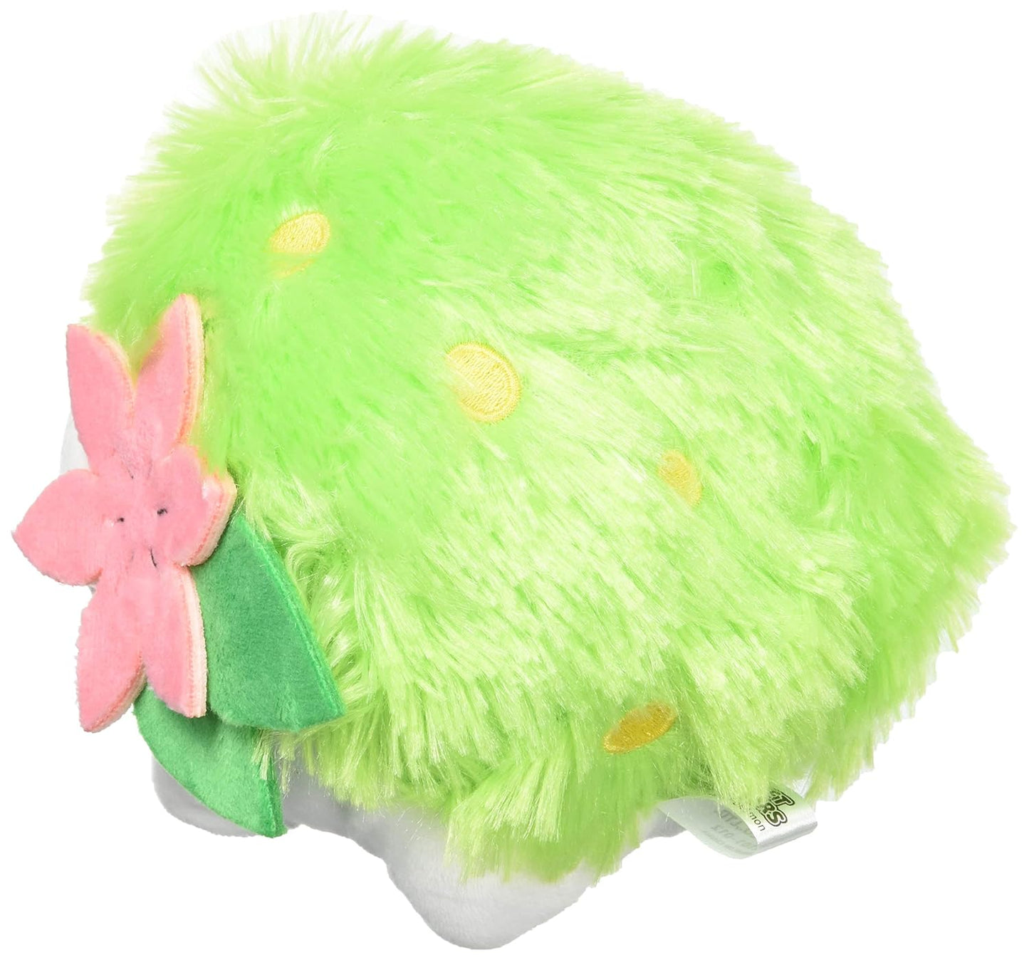 Fuzzy green Pokémon Shaymin  plush toy with yellow spots, a pink flower, and green leaves