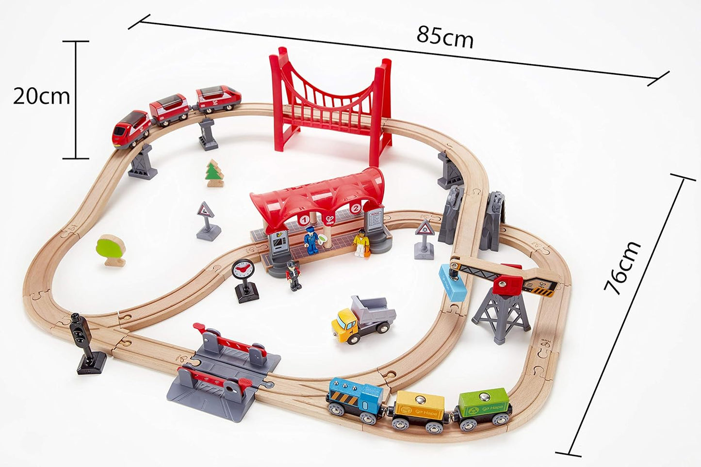 Comprehensive wooden train set featuring tracks, red bridge, station, crane, and multiple toy trains
