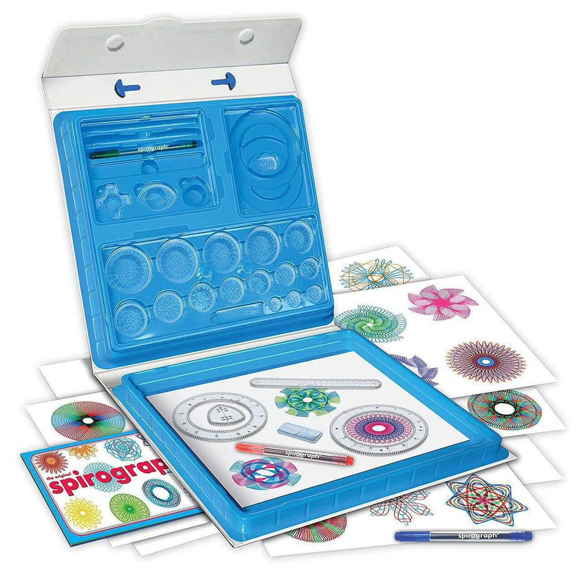 Original Spirograph Deluxe Set in an open blue plastic case displaying various gears wheels and pens alongside multiple sheets of colorful completed spirograph designs