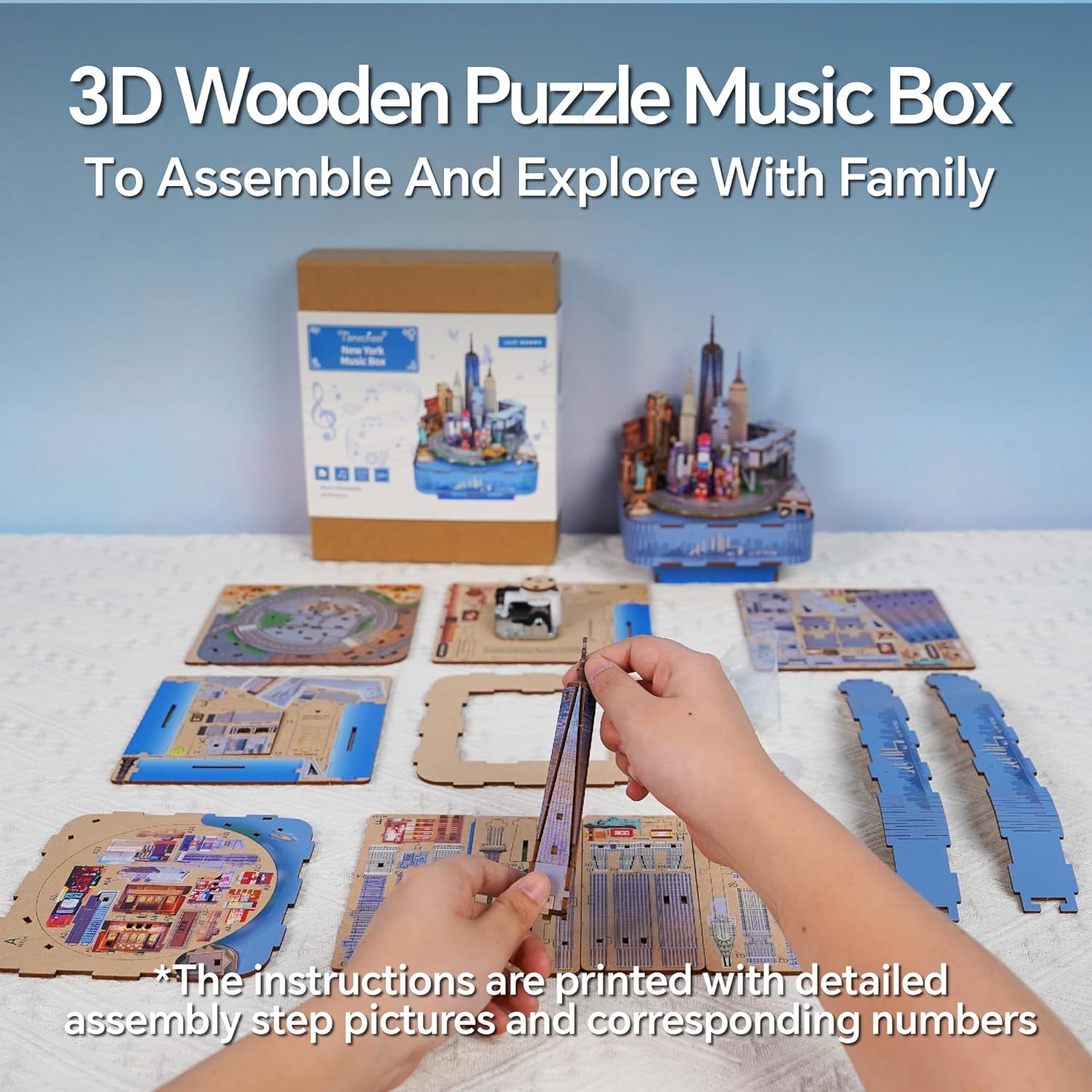 Hands assembling wooden pieces of a 3D New York skyline music box puzzle