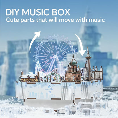 A DIY wooden music box kit depicting a winter cityscape with an illuminated Ferris wheel