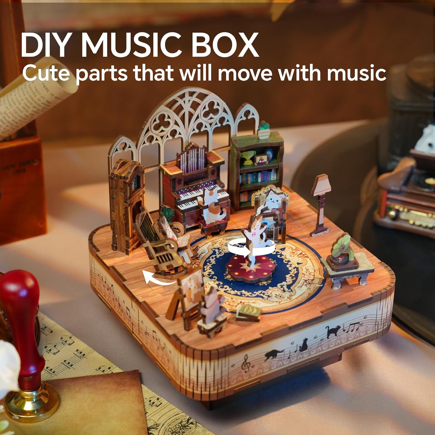 DIY wooden music box kit featuring a miniature room scene with moving cat figurines