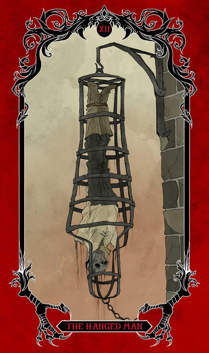 Tarot card XII, The Hanged Man: A head-down corpse in a metal cage hangs from a stone wall