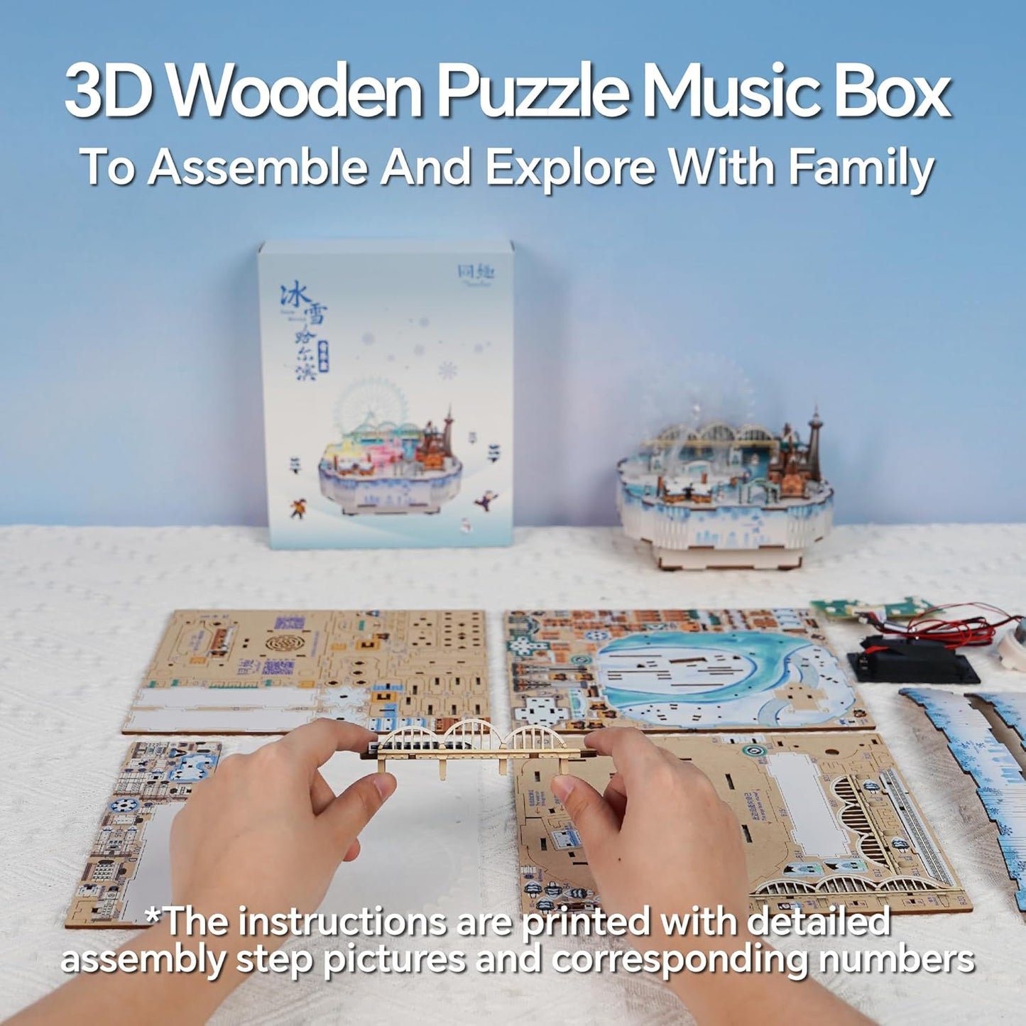 Hands assembling a wooden bridge piece from a 3D puzzle music box kit, surrounded by unassembled sheets