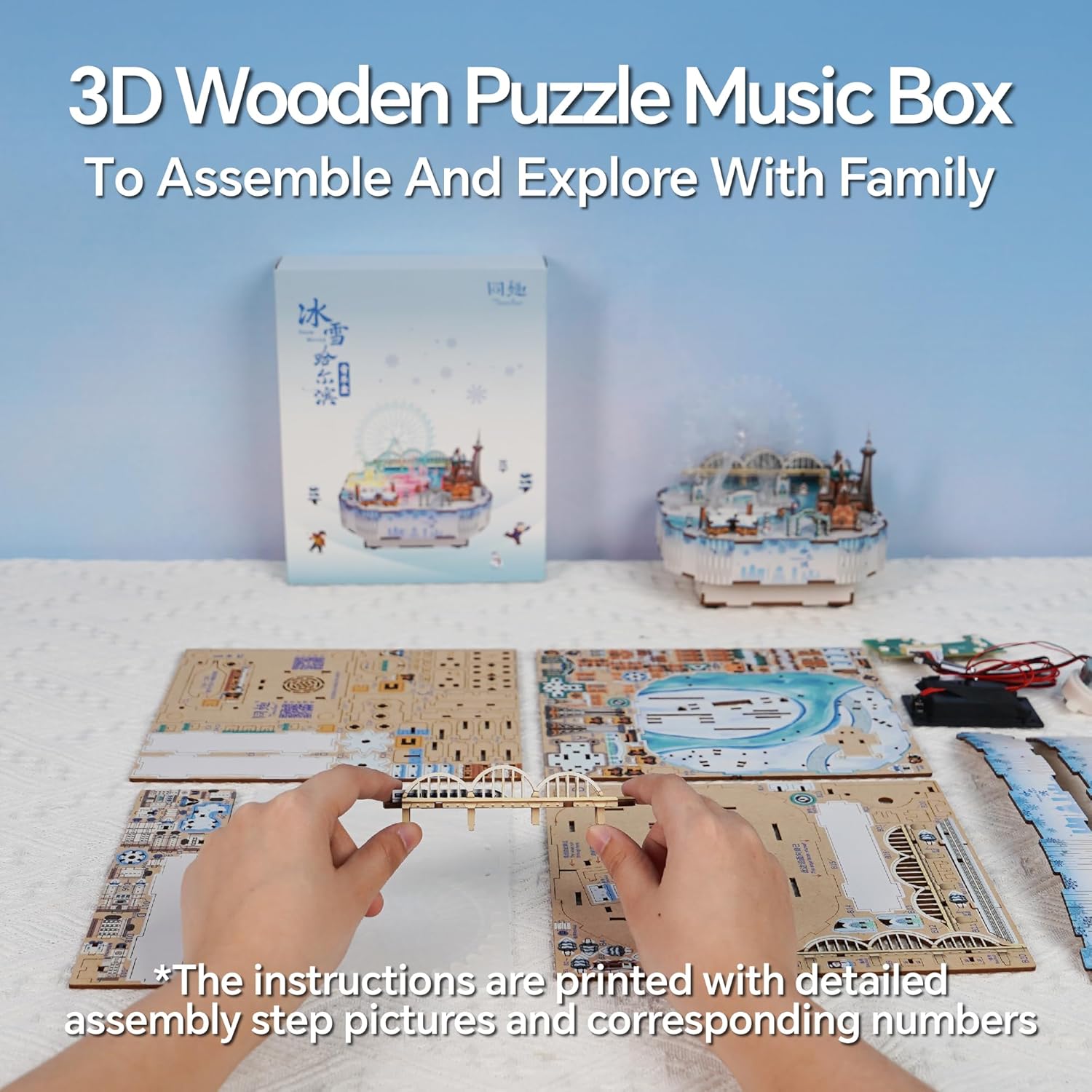 Hands assembling a wooden bridge piece from a 3D puzzle music box kit, surrounded by unassembled sheets