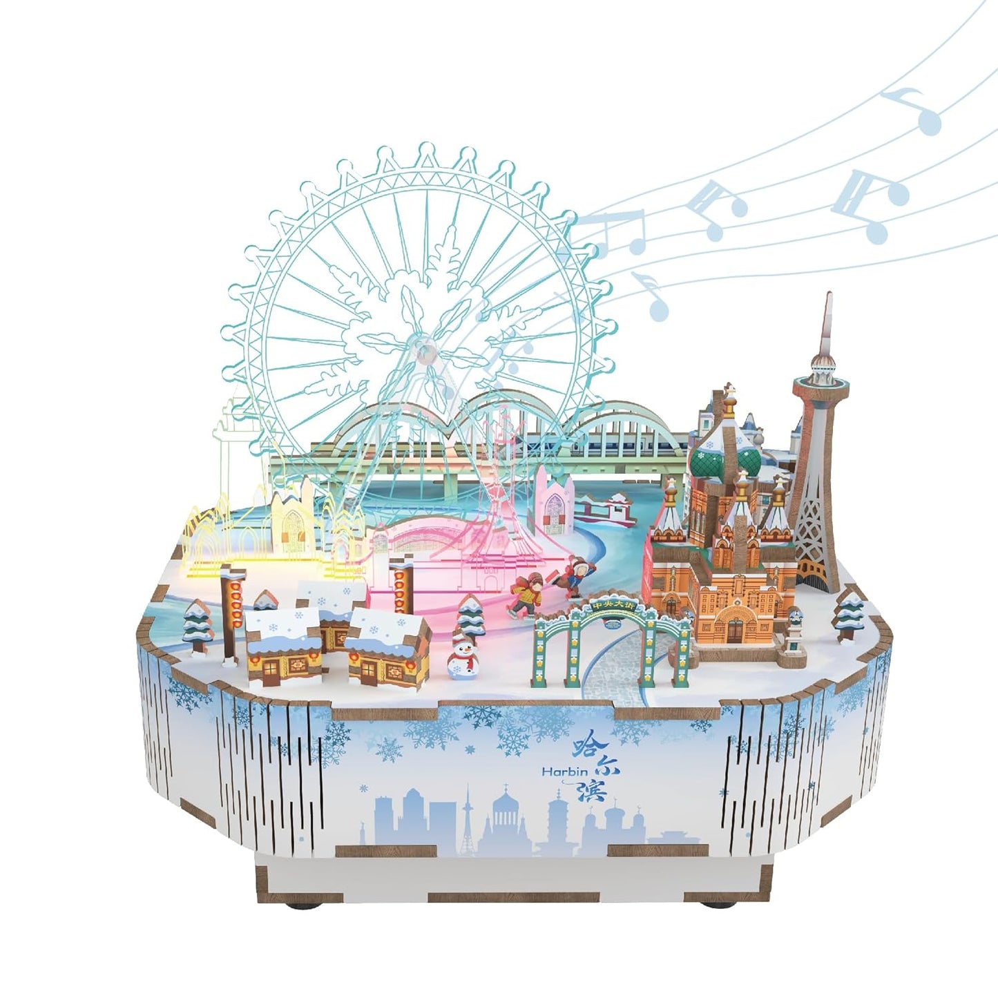 Illuminated miniature winter cityscape model featuring a large Ferris wheel and Russian-style cathedral