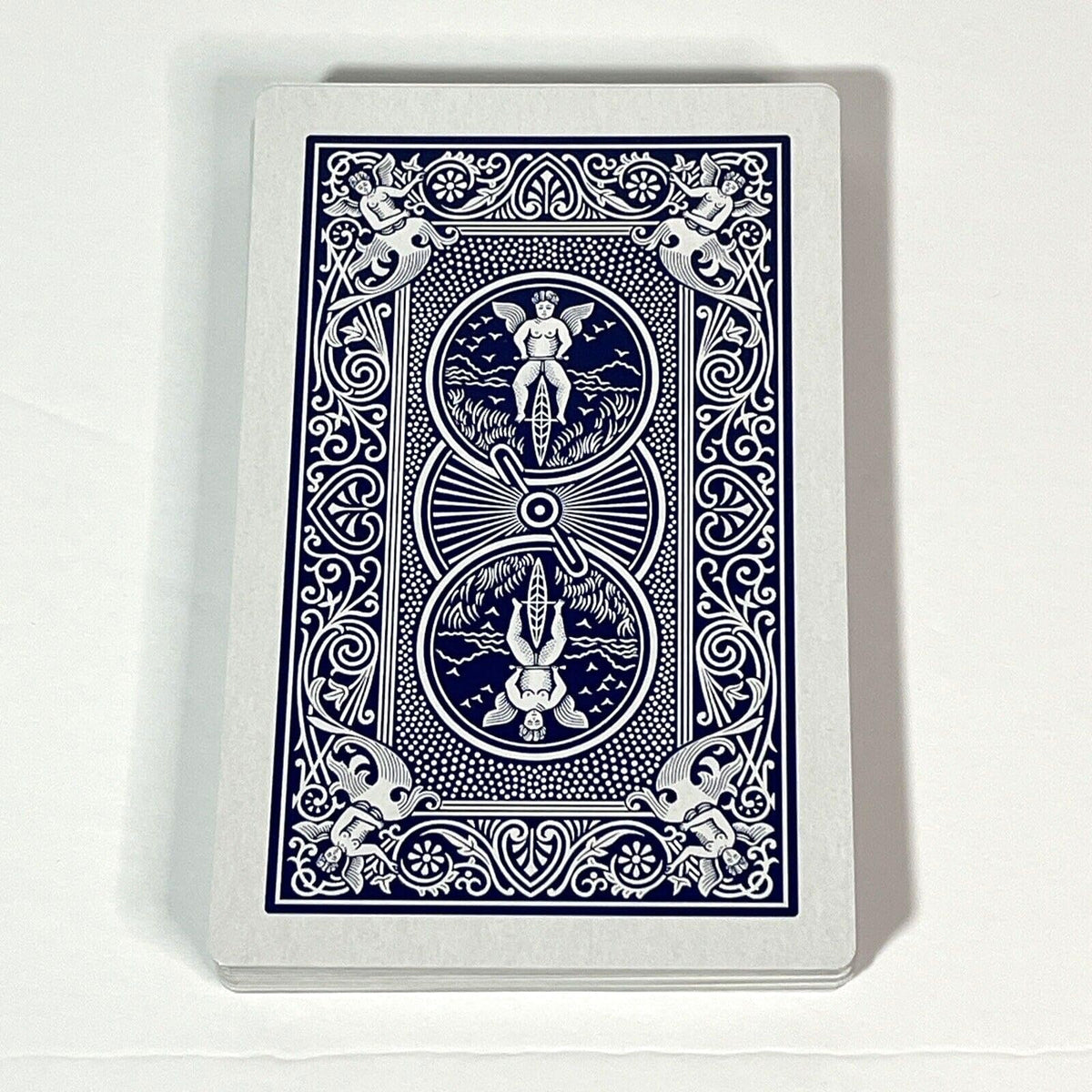 Blue and white Bicycle playing card back, featuring a cherub on a bicycle, mermaids and intricate scrollwork
